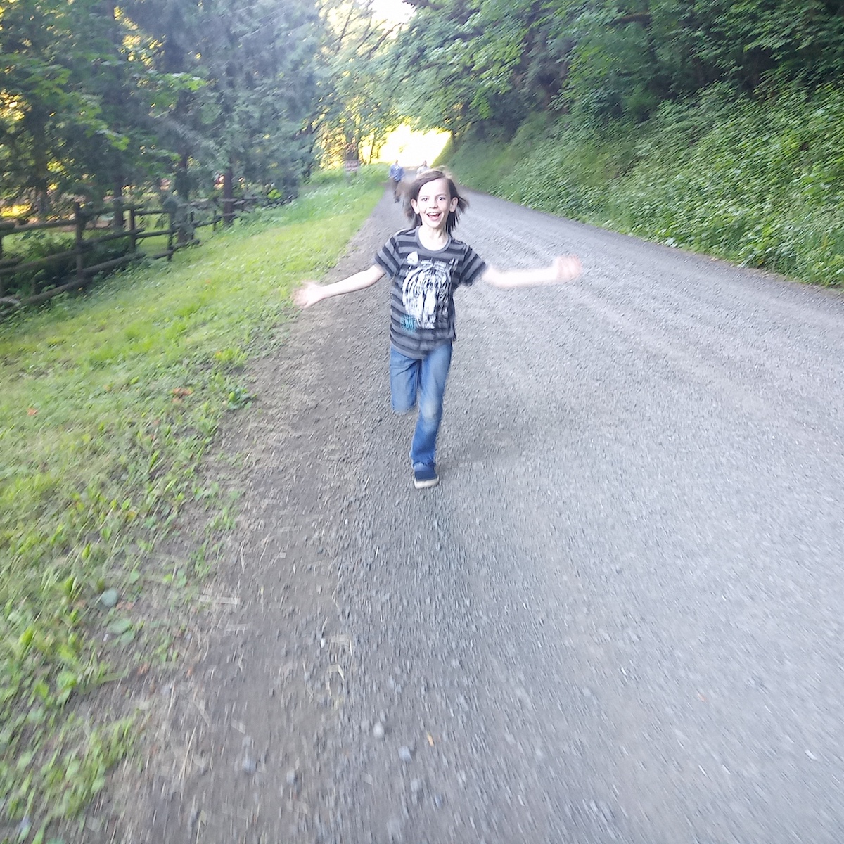 A kid running down the road toward you, arms wide open for a hug